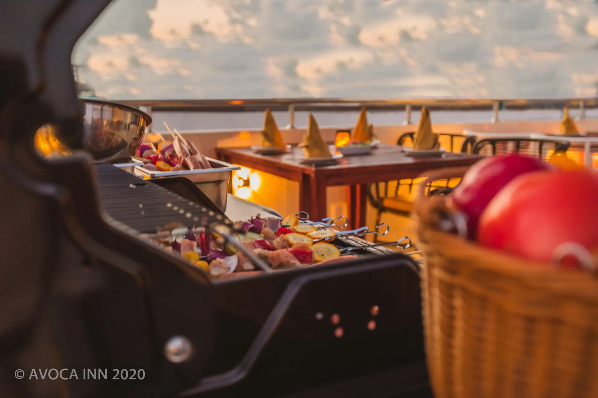 Grilling skewers on a rooftop at Avoca Inn, preparing for a delightful outdoor dining experience.